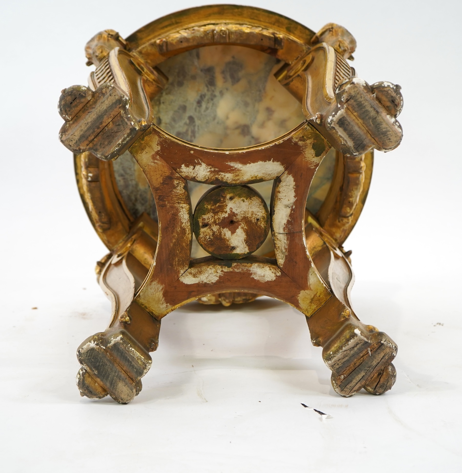 A late 19th century French circular carved giltwood and composition vase stand